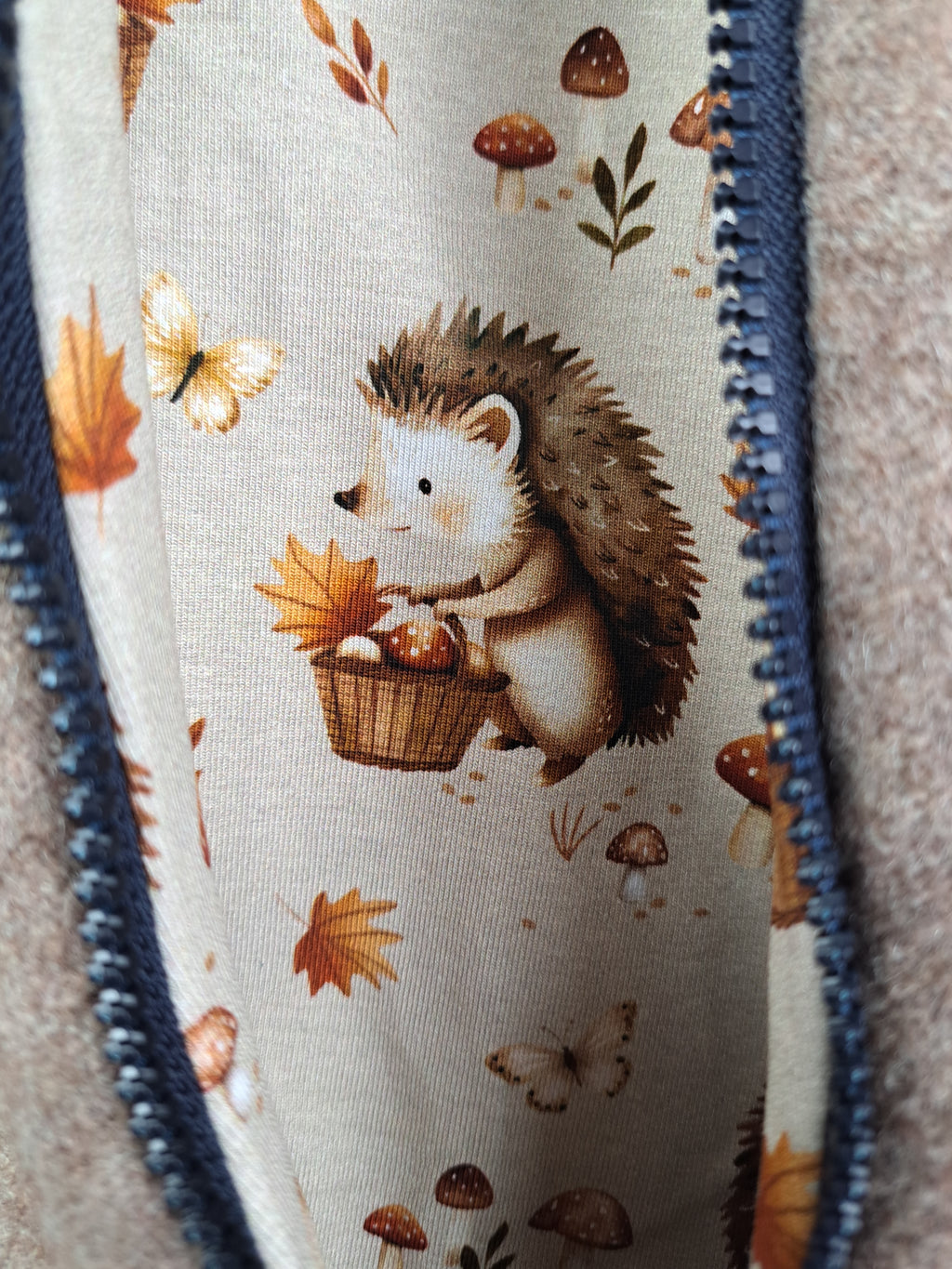 Walk overall, brown mottled, with hedgehog design