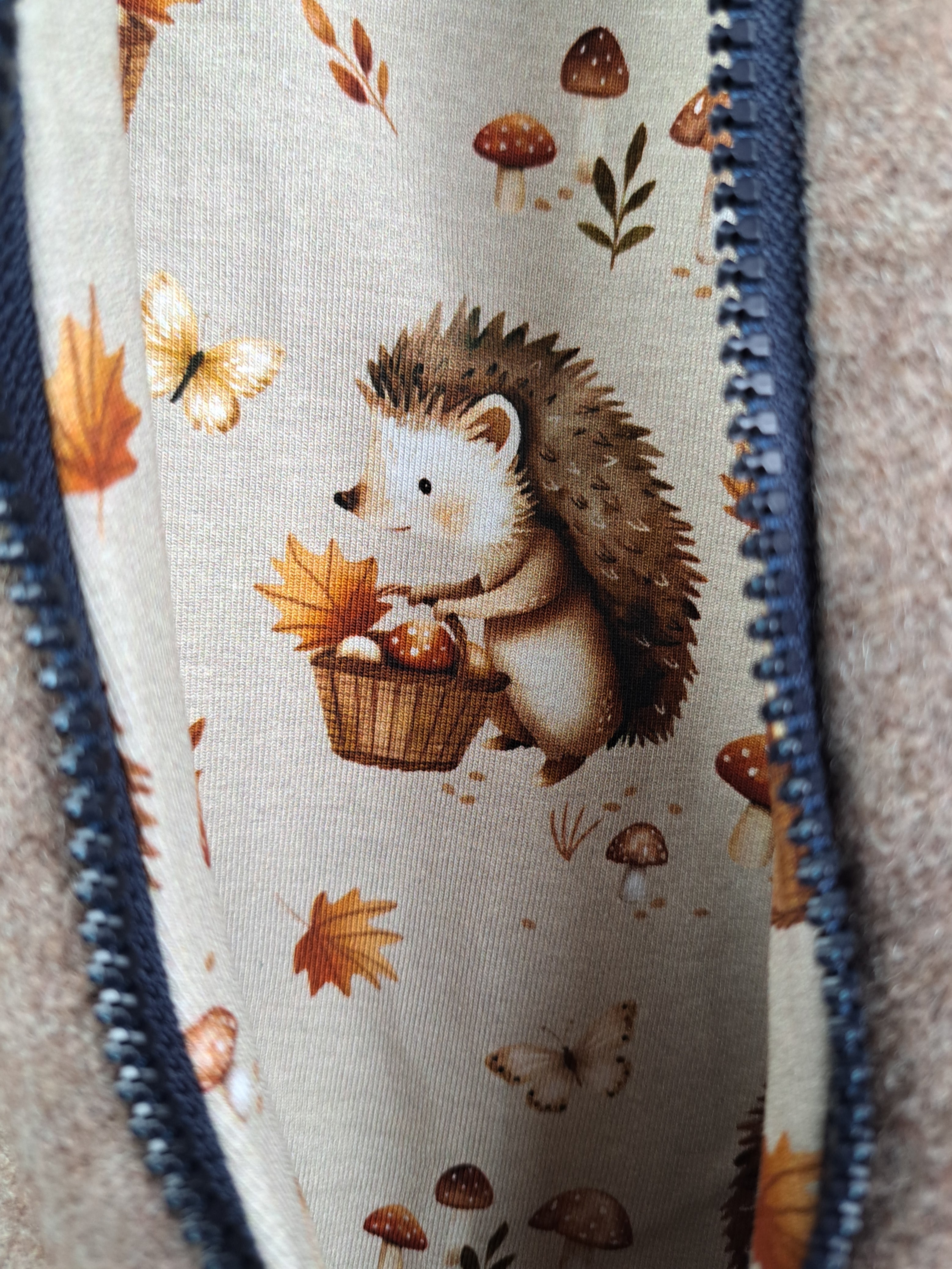 Walk overall, brown mottled, with hedgehog design