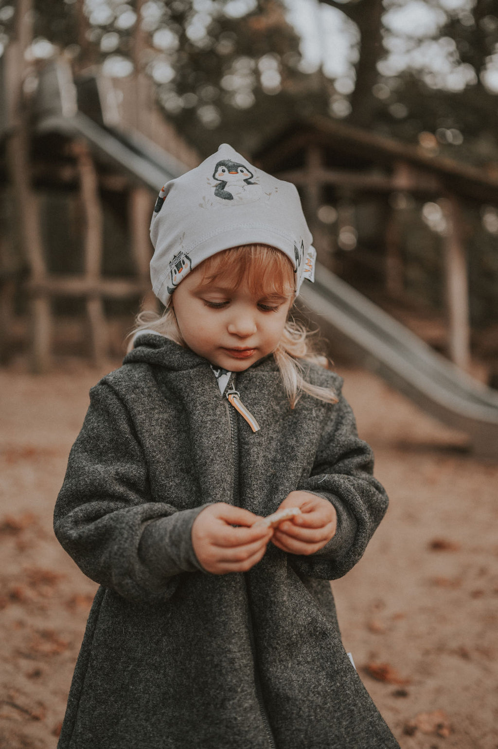 Melange grey boiled wool coat with penguin baby