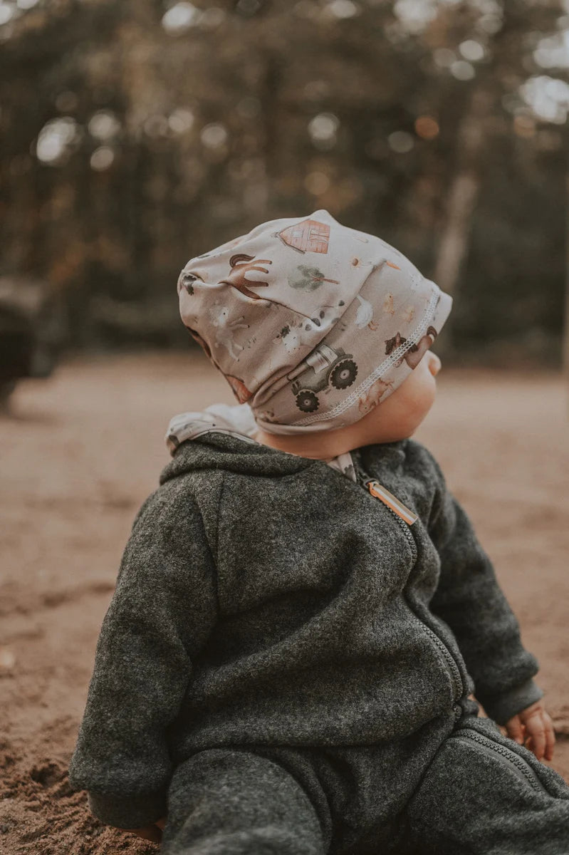 Walkoverall aus Merino Wollfleece grau mit Pinguinbaby