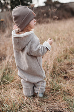 Walkoverall sand meliert mit Fuchsi creme